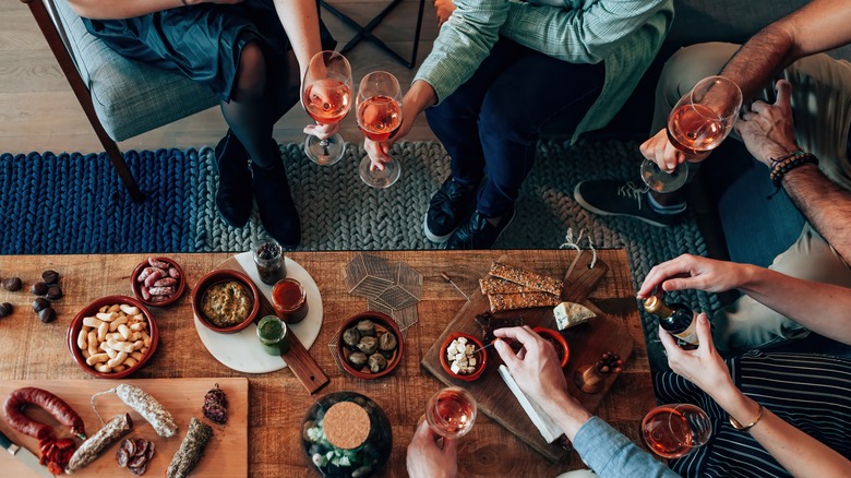 people sharing charcuterie 