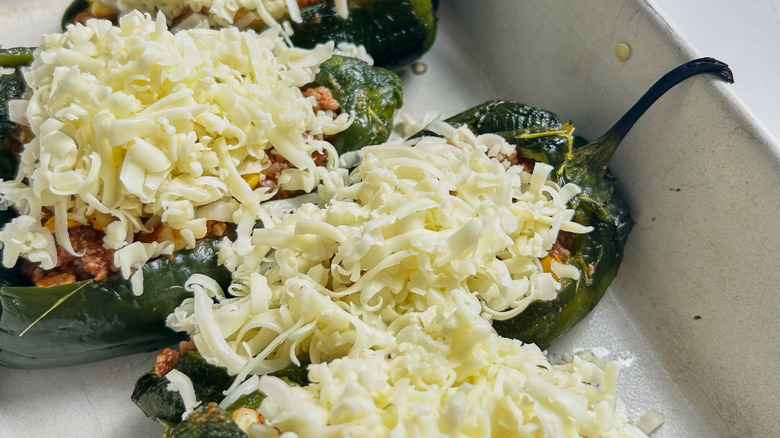 peppers stuffed with cheese in dish