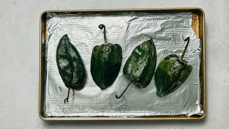 charred peppers on sheet tray