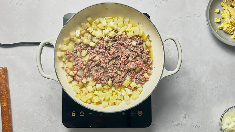 browned beef and poatoes in skillet