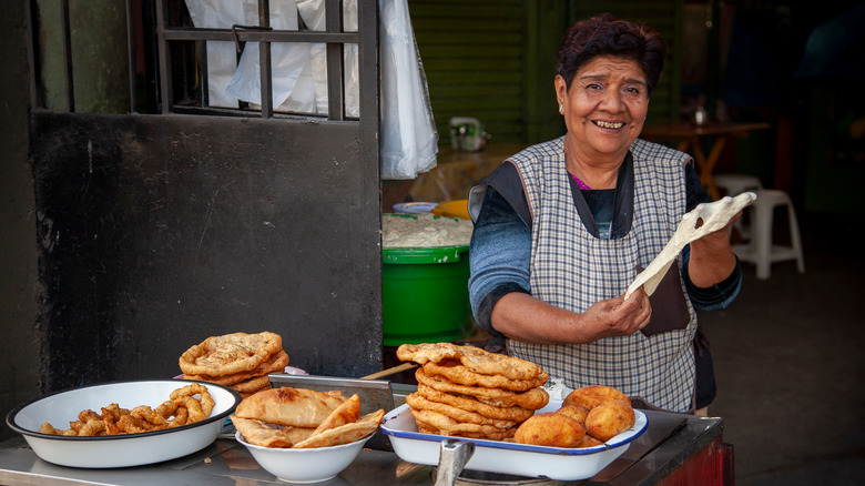 street vendor in Lima selling picarones and buñuelos