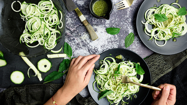 preparing pickled zucchini noodles