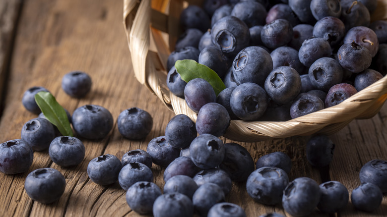 Blueberries spilling out of basket