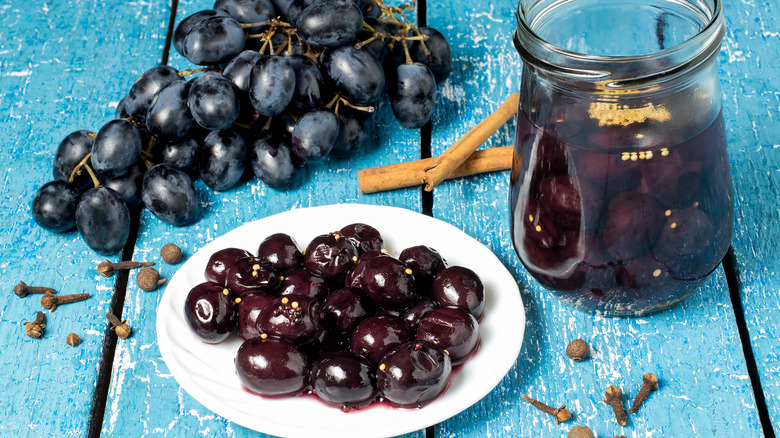 Pickled grapes marinating a jar and on a plate