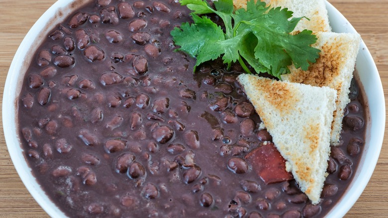 A top-down view of a bowl of black beans