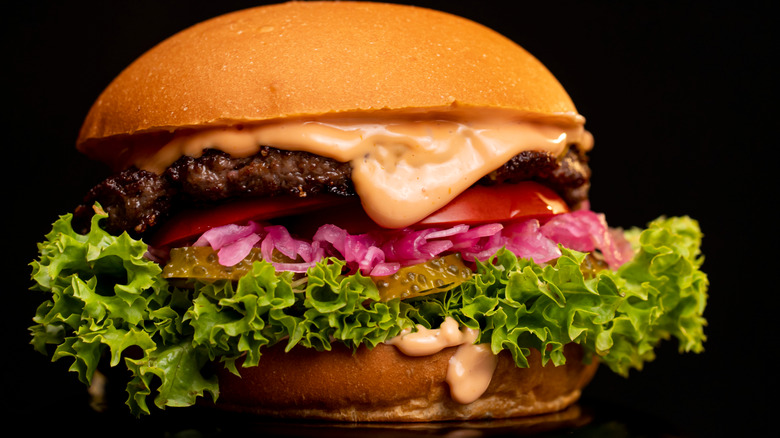 burger with pickled red onions