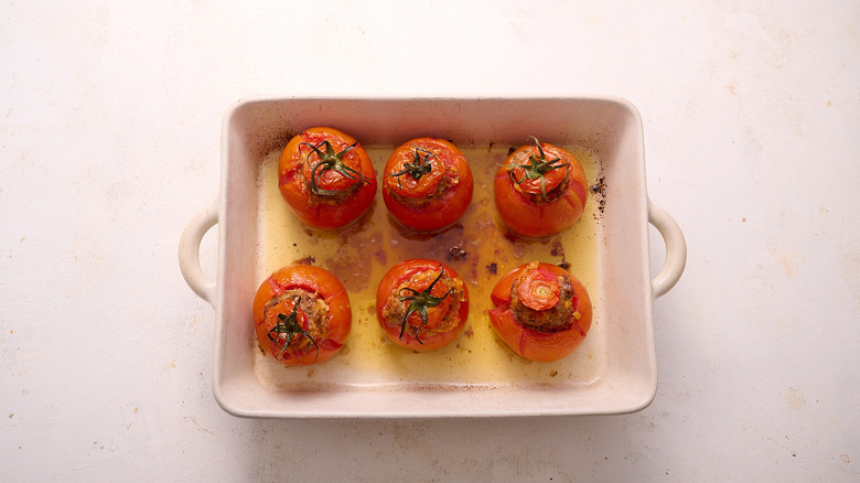 baked stuffed tomatoes in baking dish