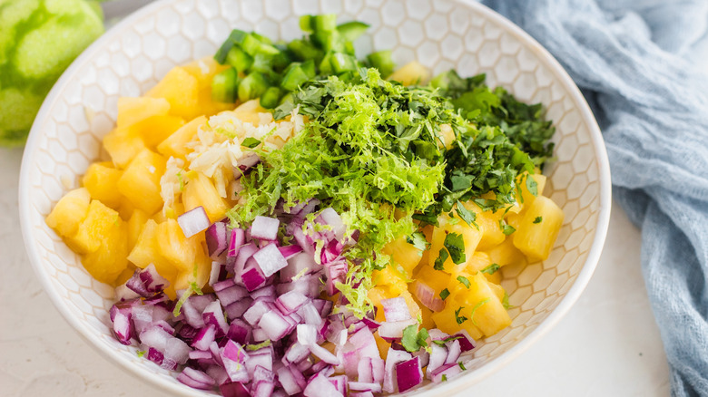 pineapple salsa ingredients in bowl 