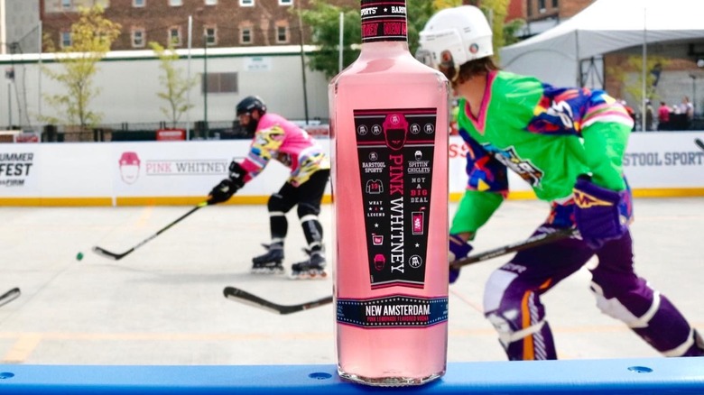 Pink Whitney bottle at hockey rink