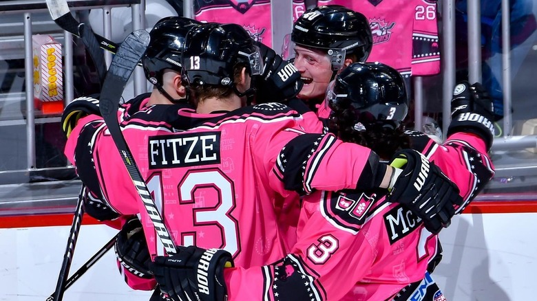 Hockey players with Pink Whitney jerseys