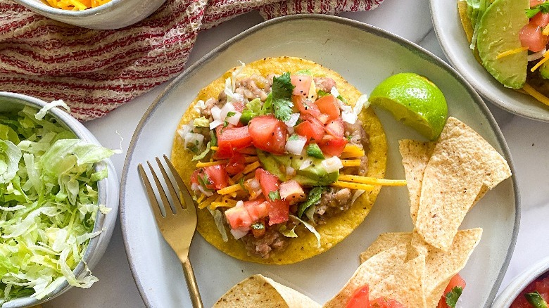 pinto bean tostada on plate