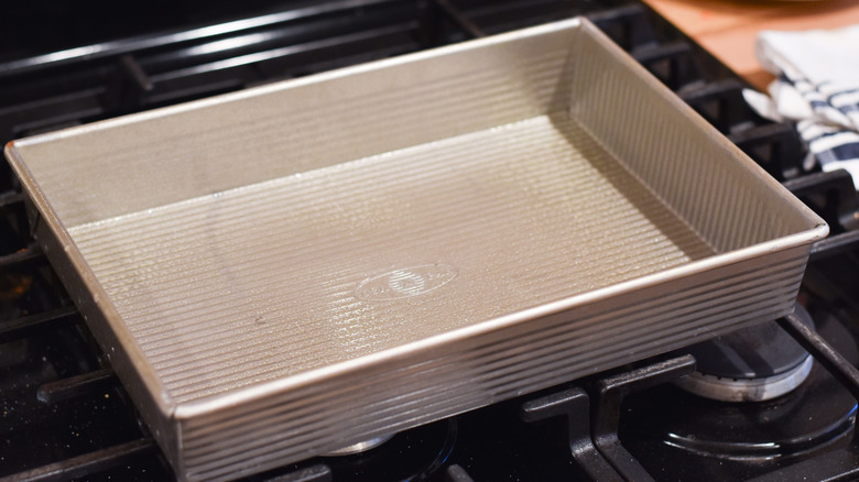 lightly greased baking dish on stove