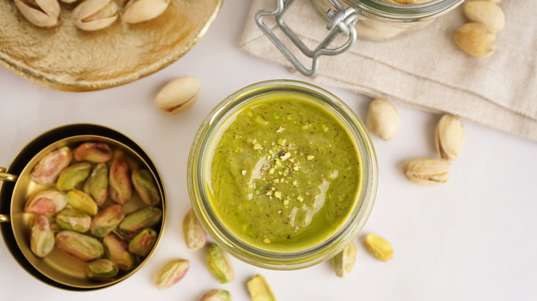 Overhead view of pistachio paste and pistachios