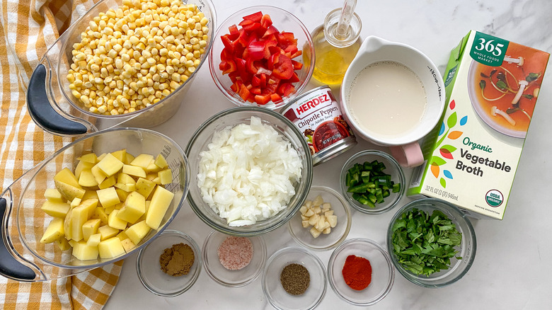 Soup ingredients in glass bowls and measuring cups