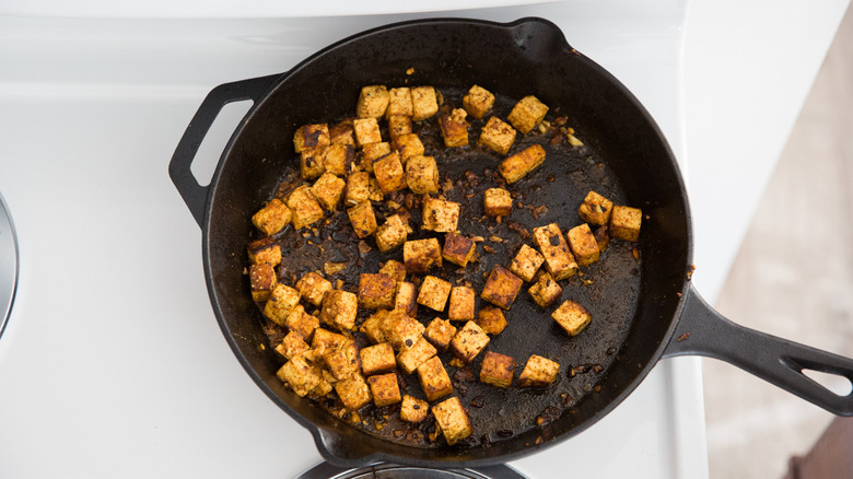 browned tofu cubes in pan