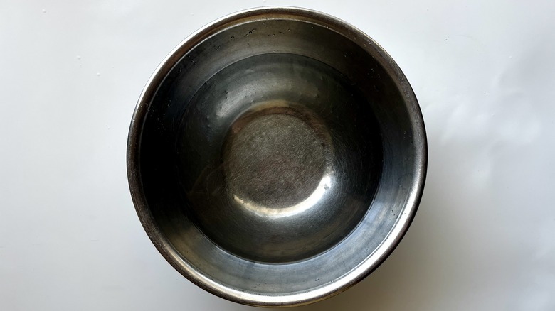 water in metal bowl