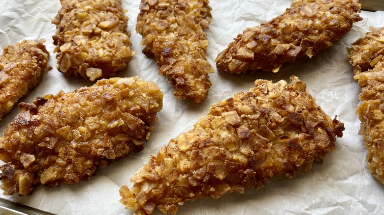 chicken fingers draining on paper