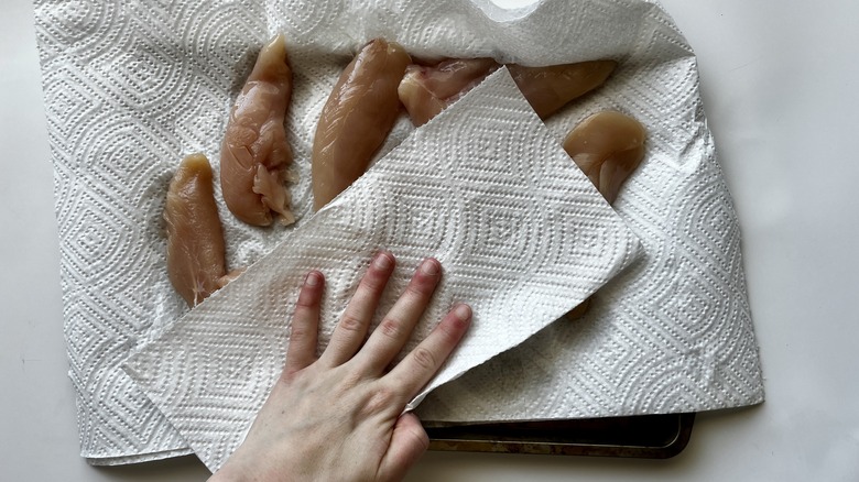 hand drying raw chicken