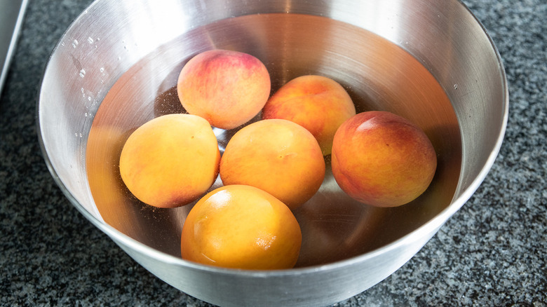 peaches in pot of water