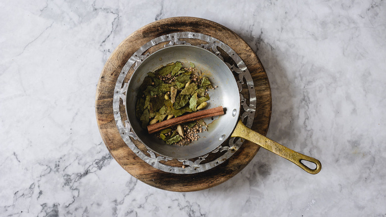 Spices in copper pan