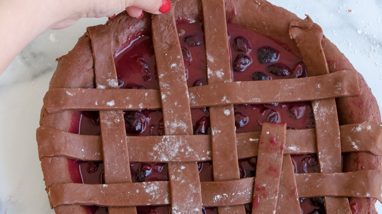 lattice design on cocoa cherry pie