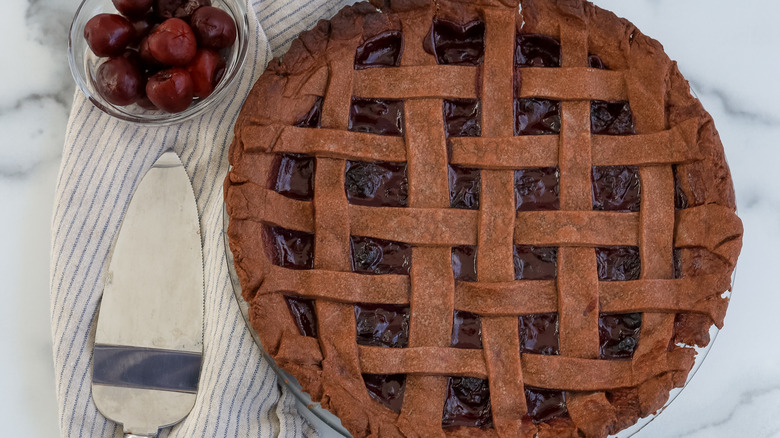 cherry pomegranate cocoa pie with slicer