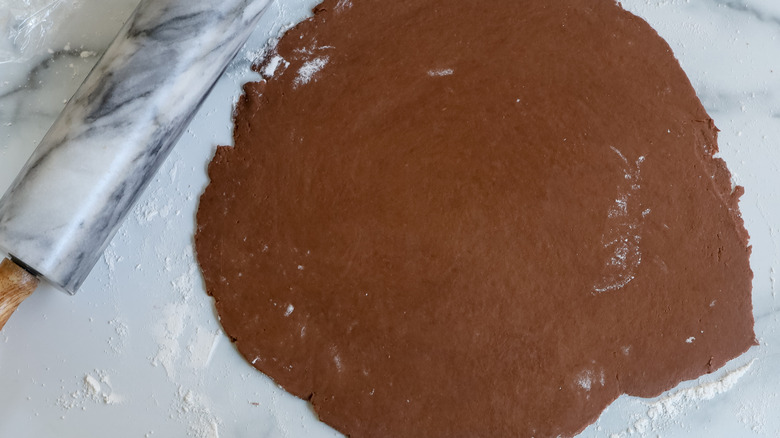 rolling out cocoa pie dough