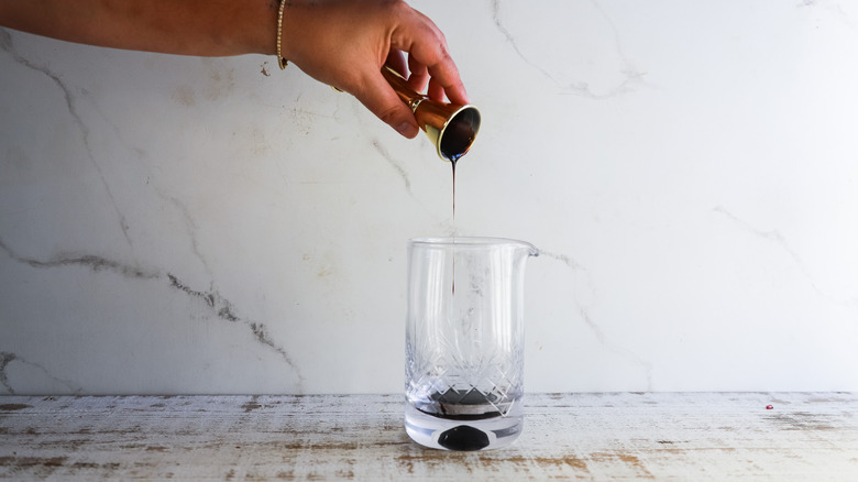 Pouring syrup into glass