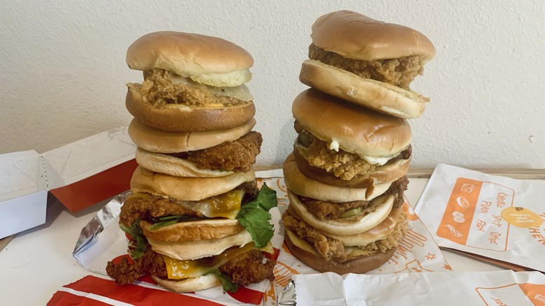 stack of Chick-fil-A and Popeyes chicken sandwiches