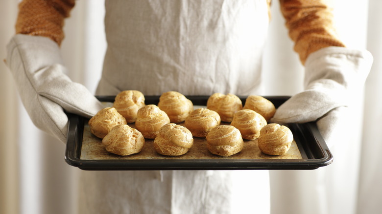 Cream puffs on baking sheet