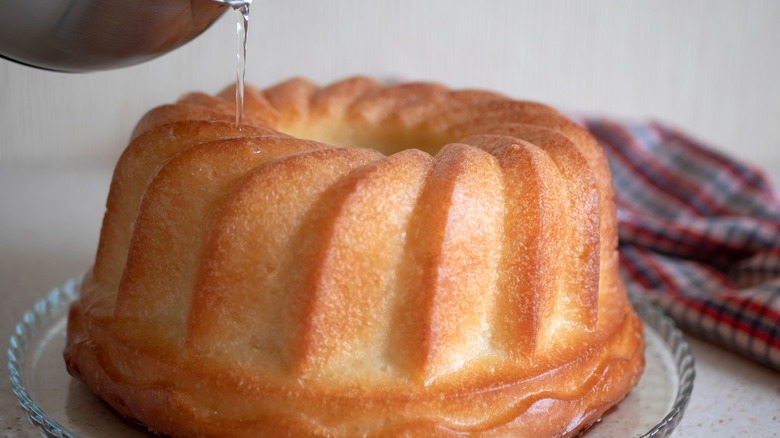 drizzling syrup on rum bundt cake