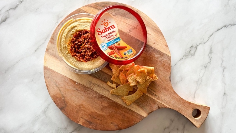 Sabra Supremely spicy hummus on marble surface