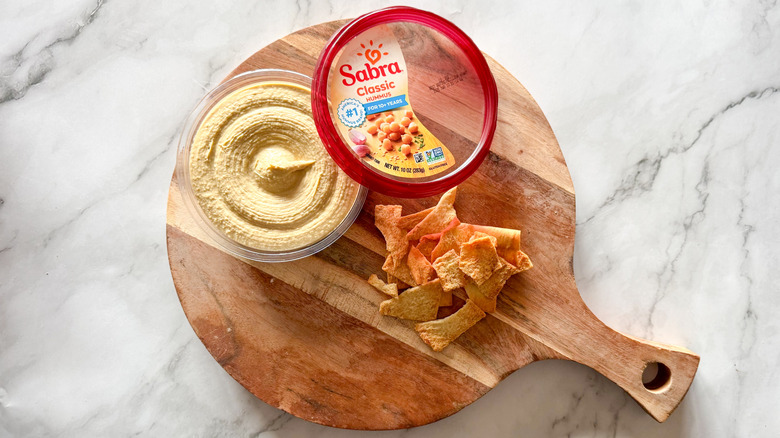 Sabra classic hummus on table with chips