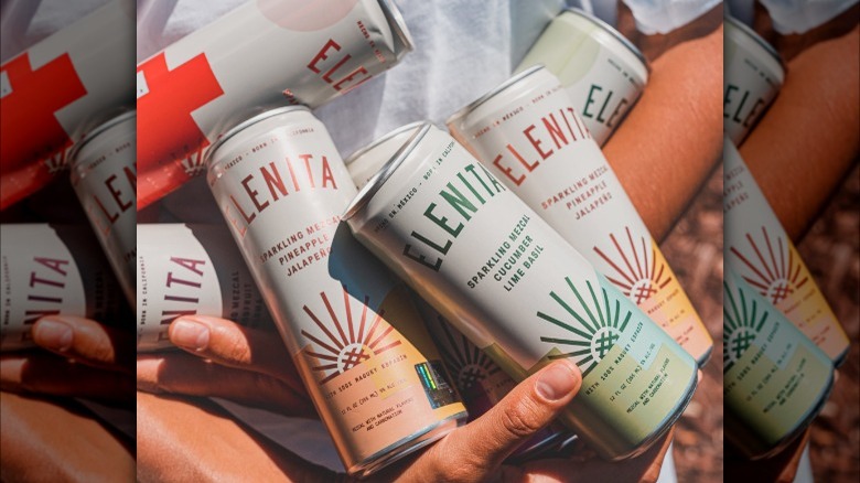 armful of Elenita canned cocktails