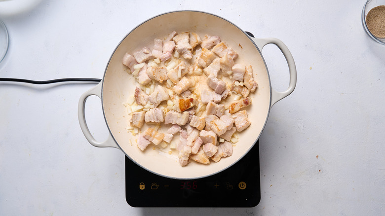 pork belly and onion cooking in pot