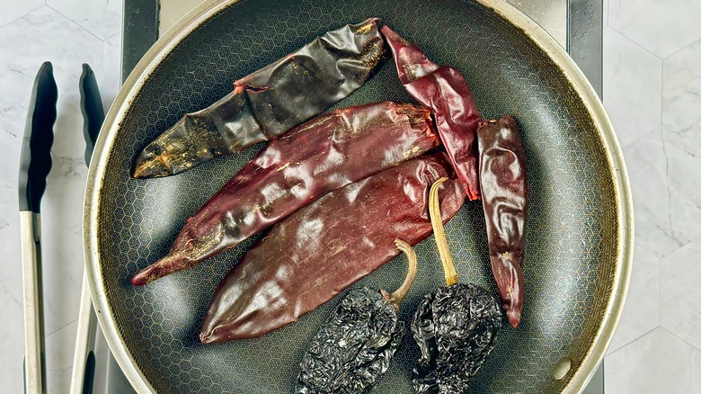 dried chiles in frying pan