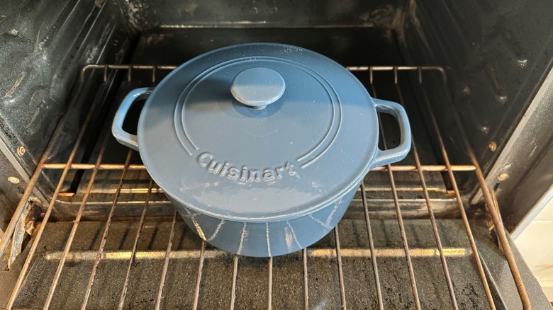 blue lidded pot in oven