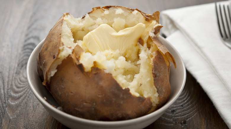 Baked potato open on plate