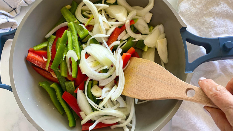 stir frying peppers and onion 