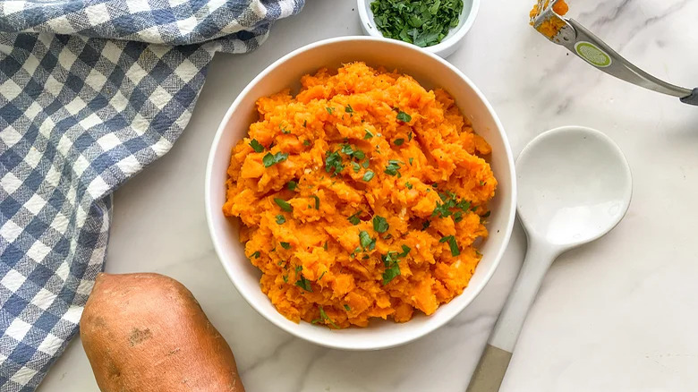 Mashed sweet potatoes topped with parsley