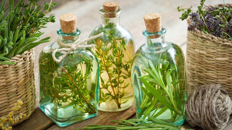 Various bottles of herb-infused vinegar 