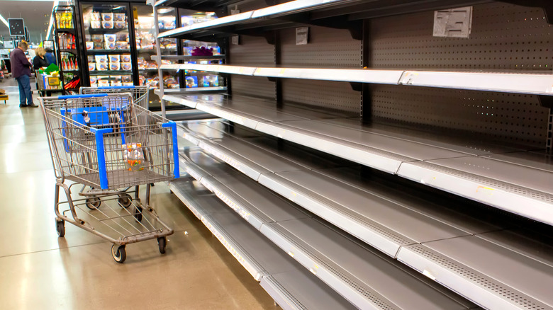 Empty grocery aisle shelves