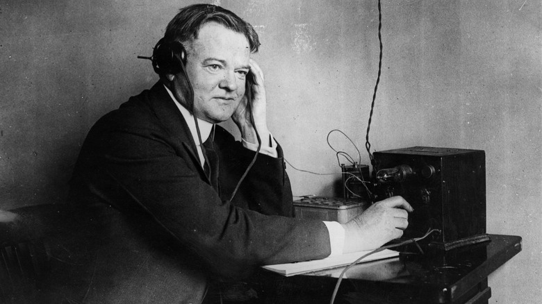 Herbert Hoover listening to a one-valve radio set