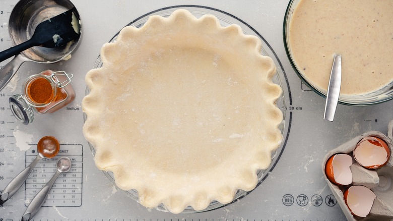 prepping uncooked pie crust for egg wash layer