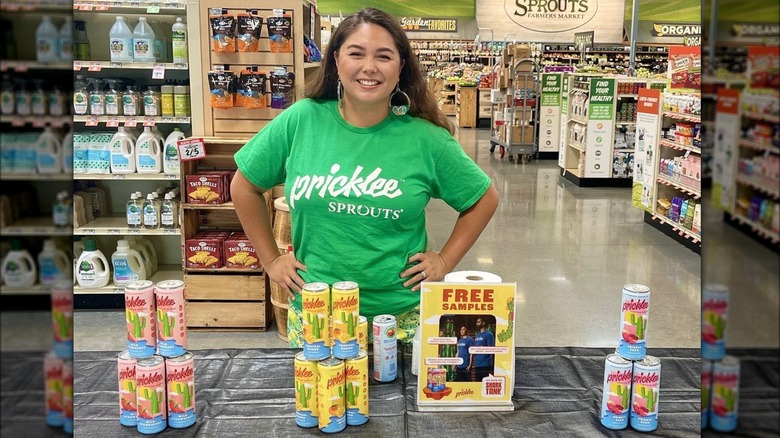 Woman giving out Pricklee in Sprouts