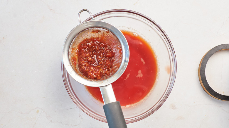 straining prickly pear syrup