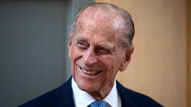 Prince Phillip smiling in a suit