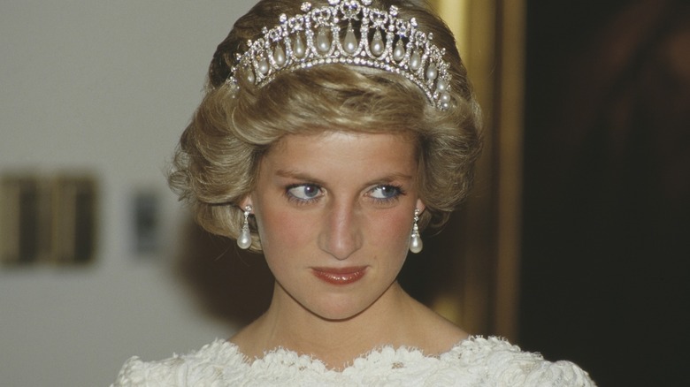 Princess Diana in a crown and white dress