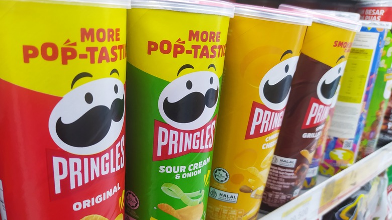 Close-up of a grocery store display of Pringles cans