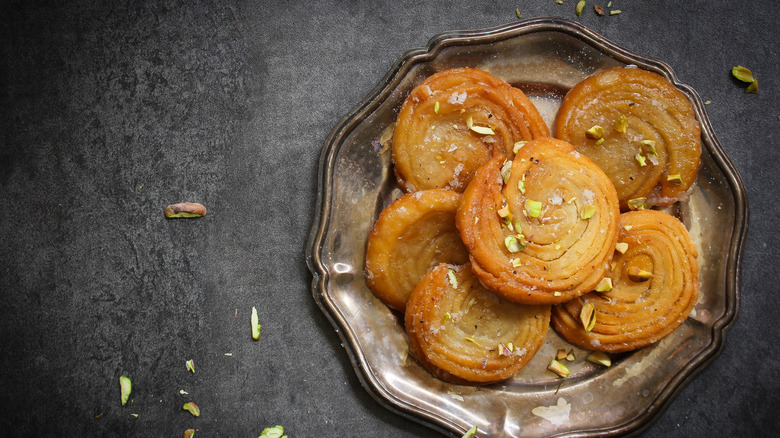 Chirote with cardamom on plate